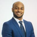 Headshot of Denszell Brown, Bitcoin-aware financial advisor in Fate, TX